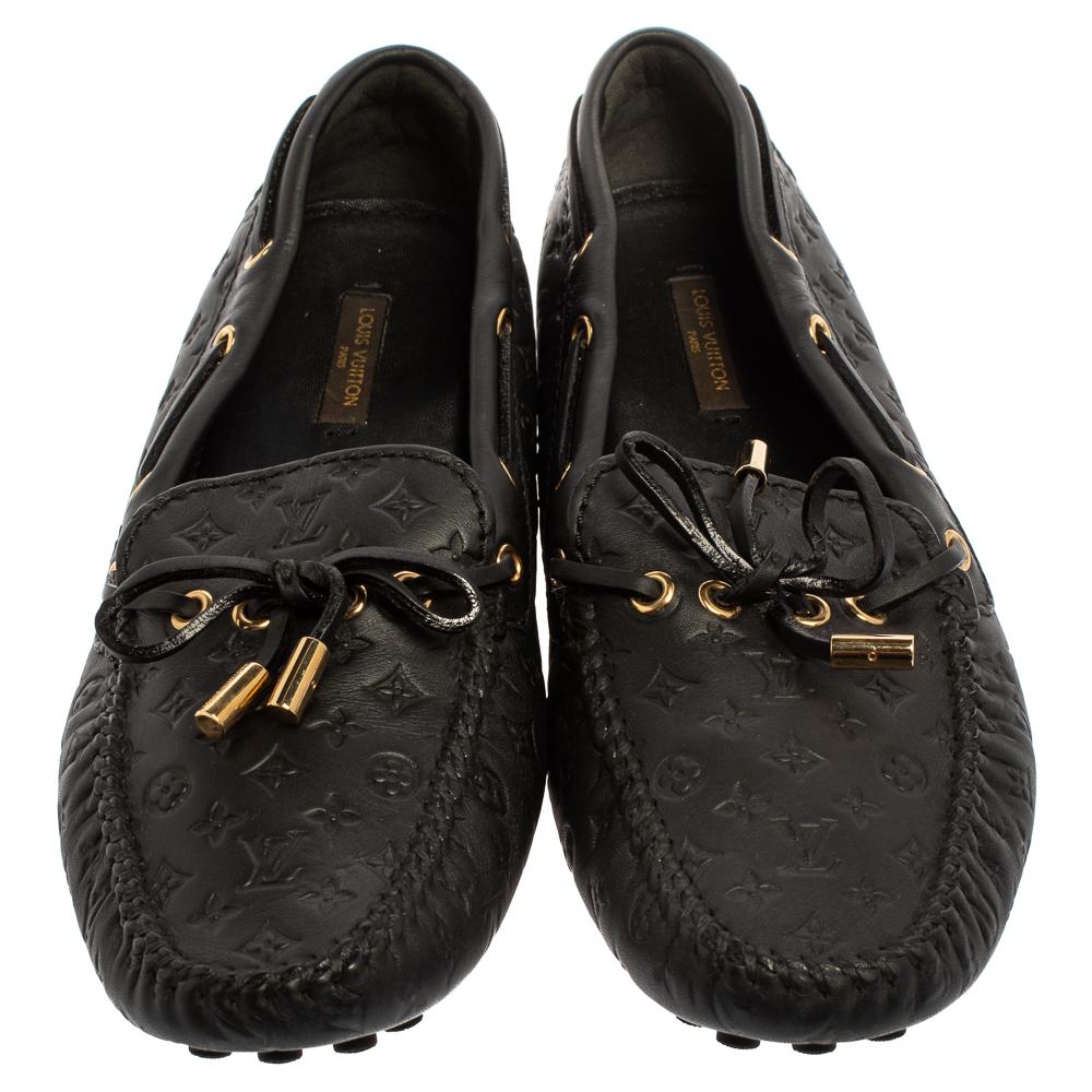 These Gloria loafers by Louis Vuitton are stylish and comfortable. Made from Monogram Empreinte leather, they feature a knotted design tied along the toplines and enhanced by gold-tone hardware. These loafers are designed to give the best impression