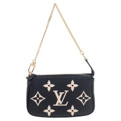 Used Louis Vuitton Black Monogram Empreinte Leather Mini Pochette Accessoires