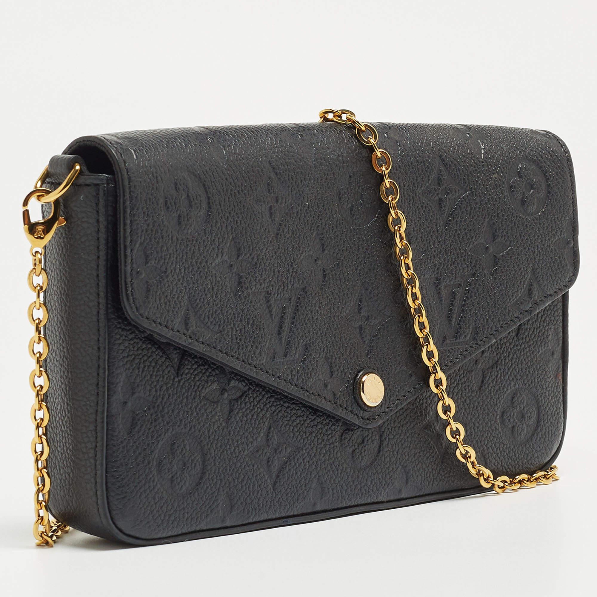 This Pochette Félicie has been designed to be a shoulder bag as well as a clutch. It is crafted from black Monogram Empreinte leather and has a canvas-lined interior, an envelope flap, and a gold-tone chain. The bag comes in a convenient size that