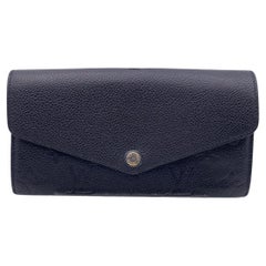 Louis Vuitton - Portefeuille noir Empreinte Sarah avec monogramme M61182