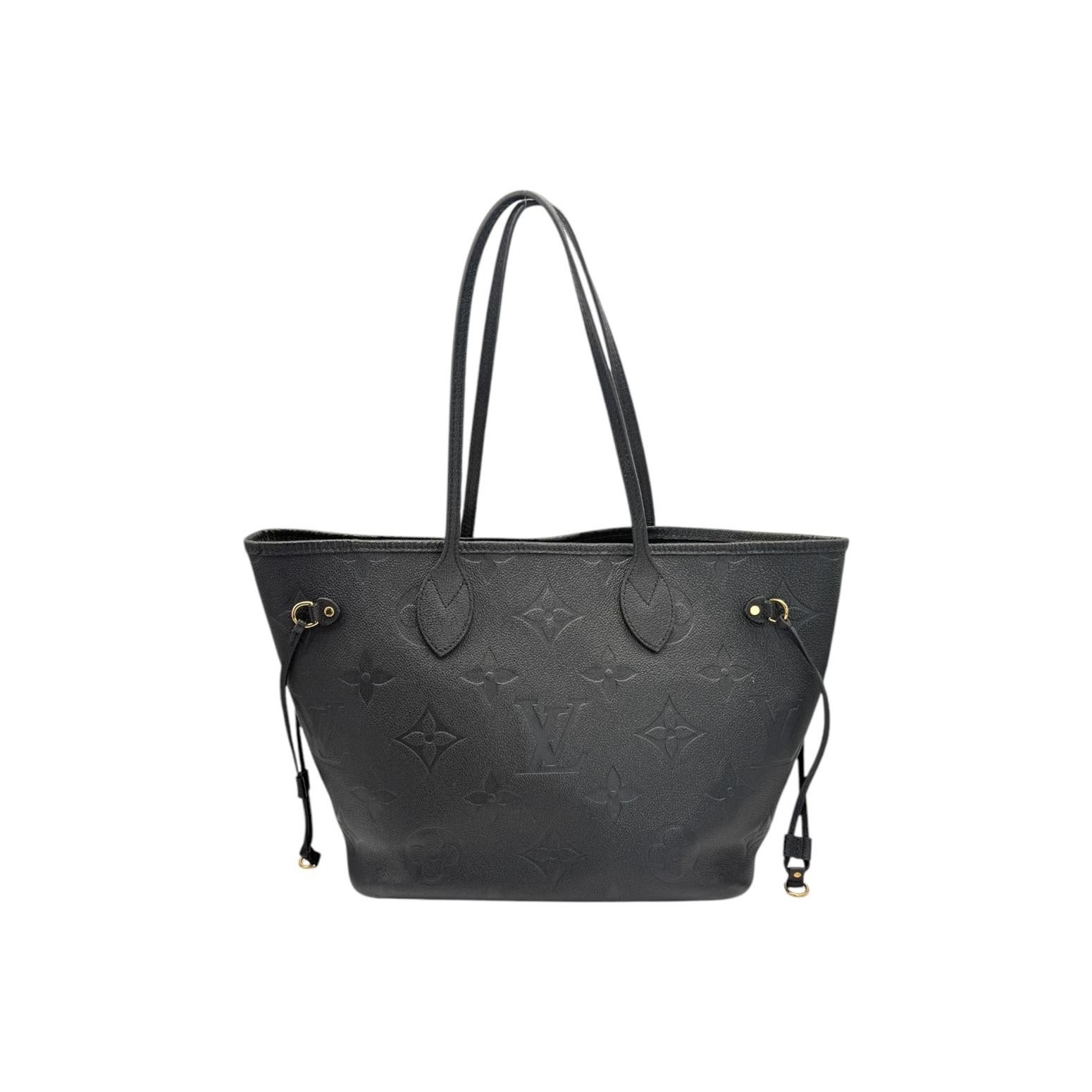 Elevate your style with the Louis Vuitton Monogram Giant Empreinte Neverfull MM. Crafted in France from luxurious Monogram Empreinte cowhide leather, this designer bag features a microchip date/authentication code for authenticity. With a spacious