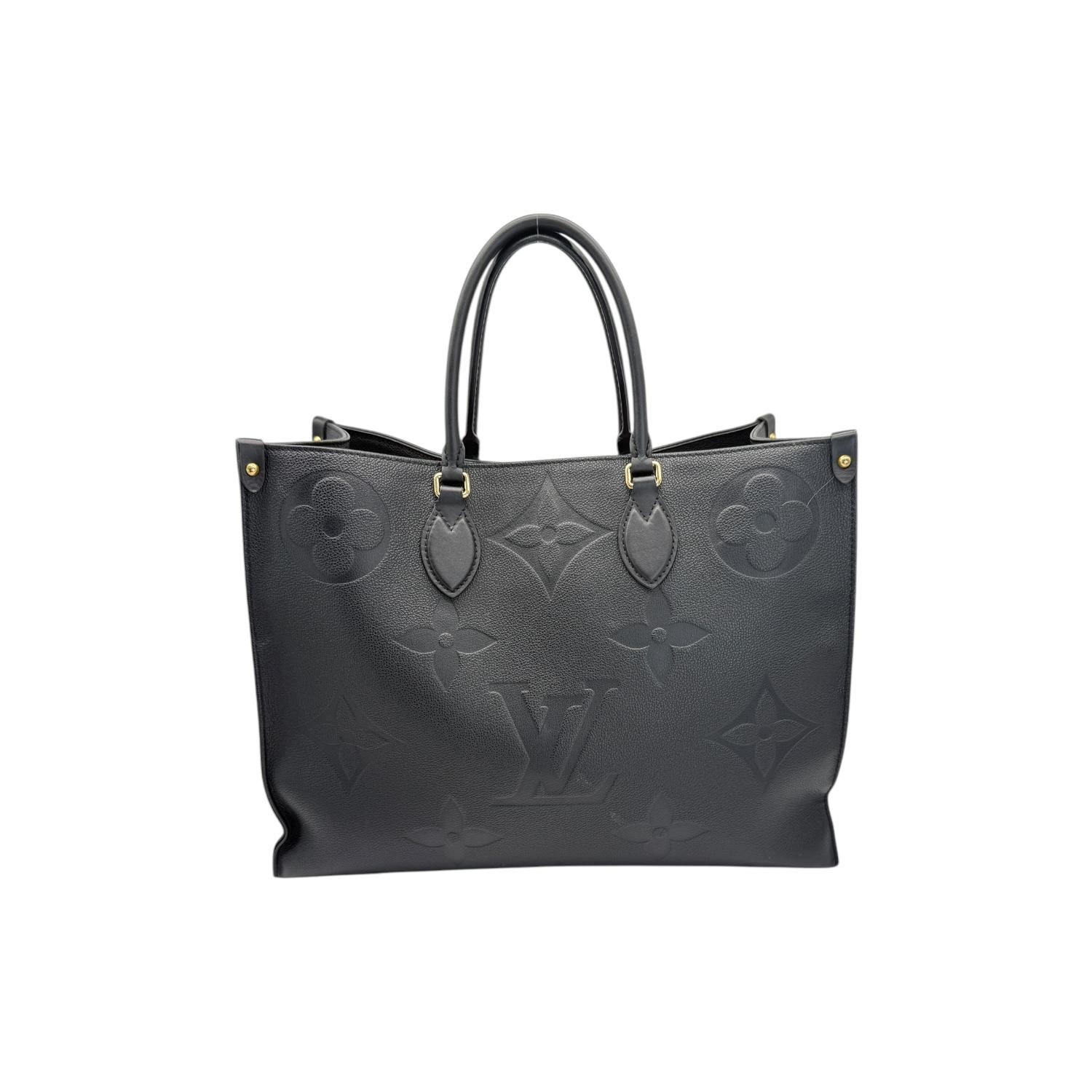 Elevate your style with the Louis Vuitton Black Monogram Giant OnTheGo GM. Crafted with luxurious black Monogram Empreinte leather and complemented by cowhide leather trim, this designer bag exudes sophistication. The spacious interior, gold-tone