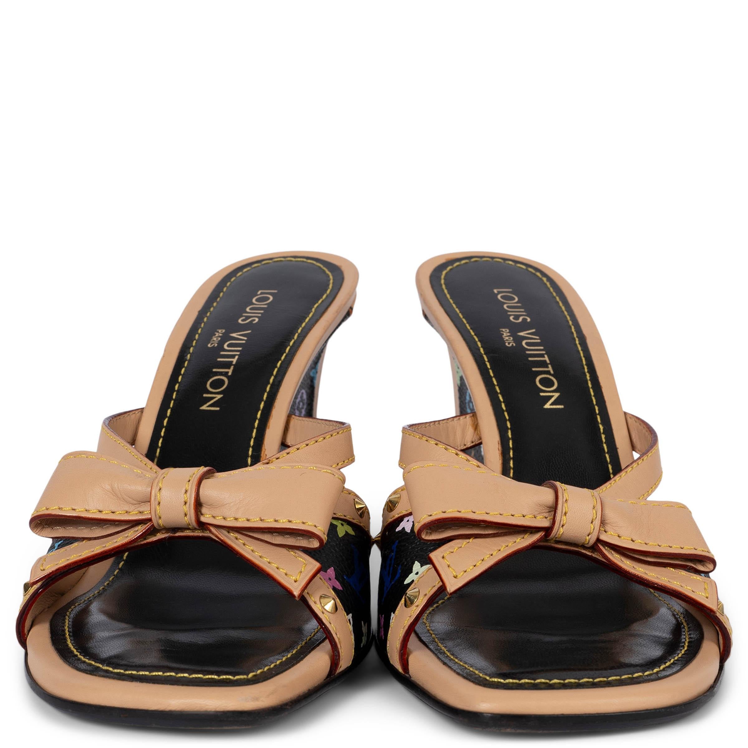 100% authentic Louis Vuitton wedge mule sandals in multicolor Monogram canvas by Takashi Murakami featuring signature leathr cowhide leather trims and bow completed with gold-tone studs. Have been worn and are in excellent condition.