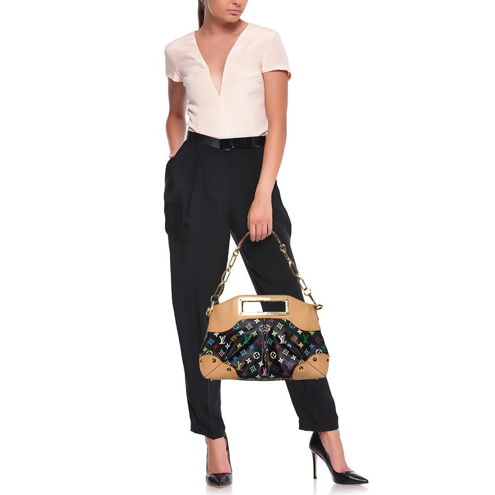 It is every woman's dream to own a Louis Vuitton handbag as appealing as this one. Crafted from Monogram Multicolore canvas and leather, this Judy MM features a detachable chain handle and frame handles engraved with the brand label. While the