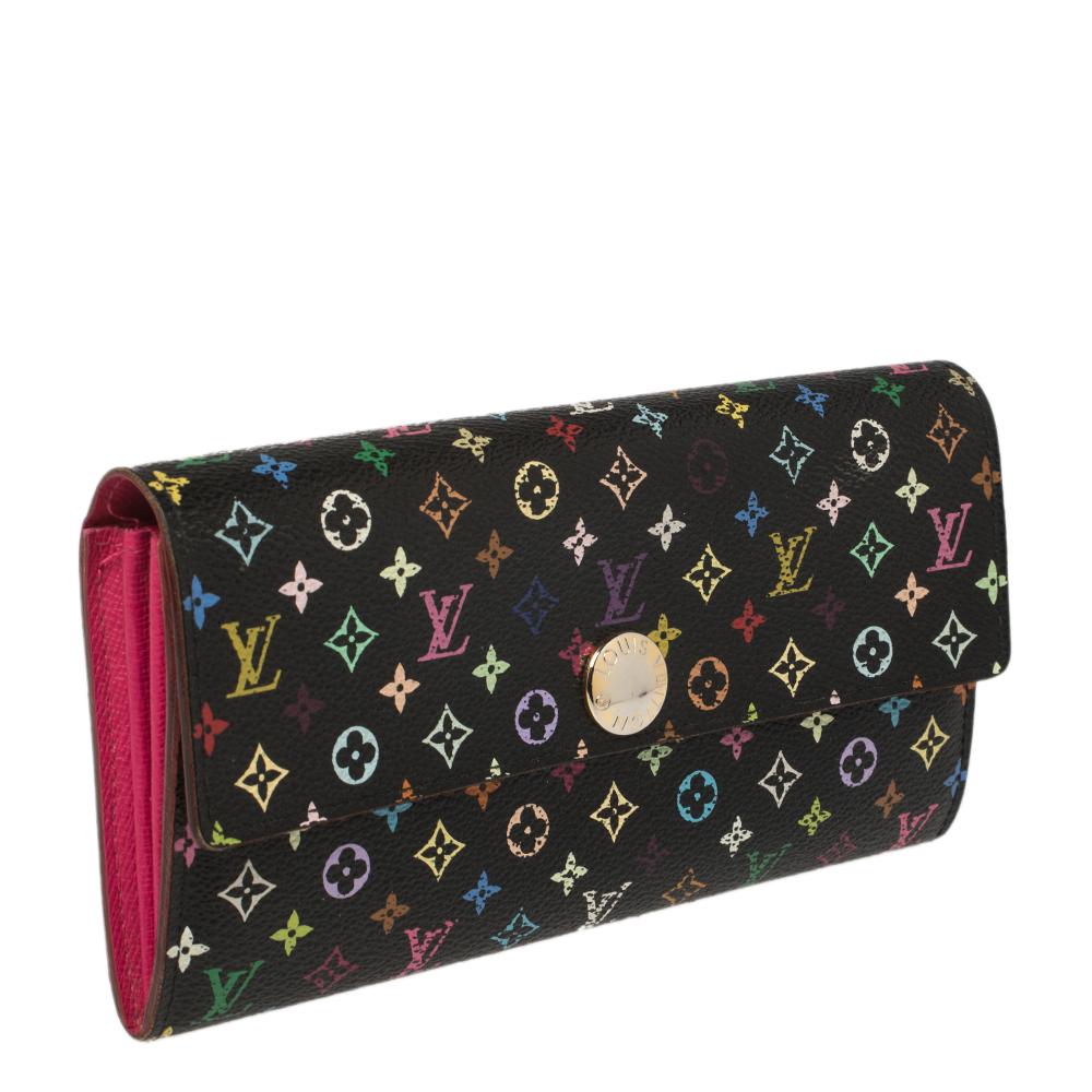 One of the most famous wallets by Louis Vuitton is the Sarah. This one here comes made from Monogram Multicolore canvas and the press button on the flap opens to an interior with multiple card slots and a zip pocket. Perfect in size, this wallet can