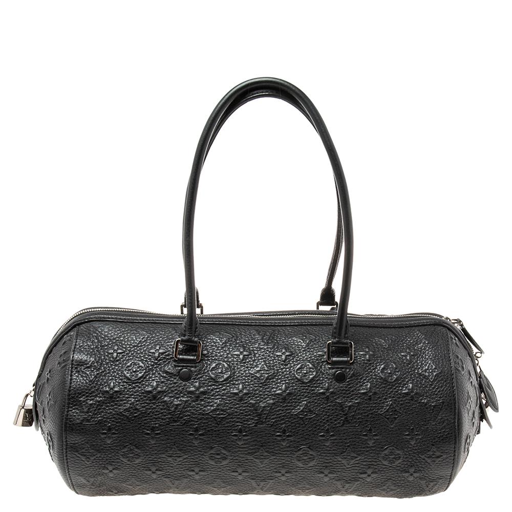 Another classic from the house of Louis Vuitton is this beautiful Papillon. Here, we have this Revelation Neo Papillon GM in black monogram leather, lending it a luxe look and durability. The top zip closure opens to a roomy Alcantara interior that