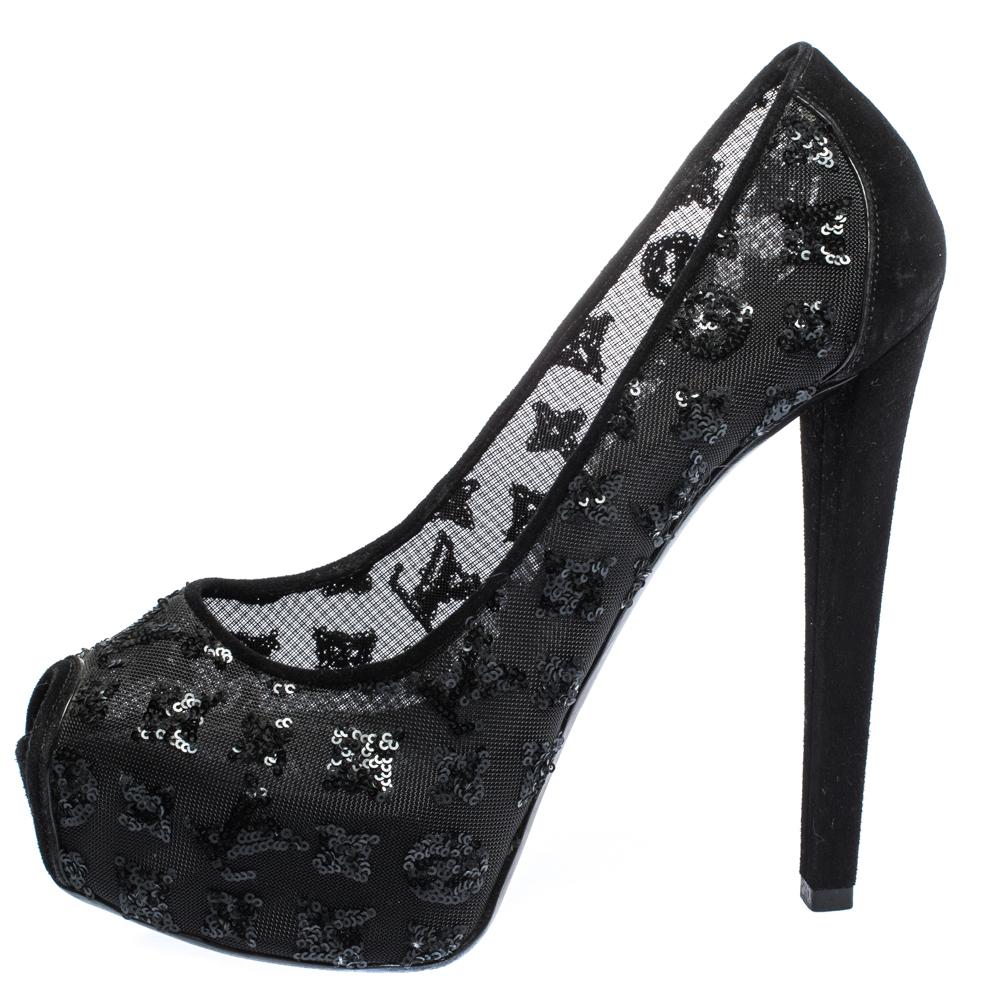 Add a feminine touch to your outfit with this pair of Louis Vuitton pumps. Beautifully designed, this pair of pumps feature a beautiful exterior rendered in suede, mesh and crystals. These black pumps are complete with peep toes and high heels.


