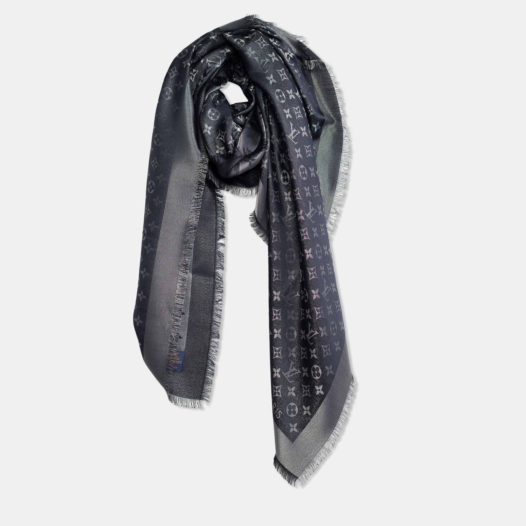 Louis Vuitton's famous monogram comes alive in this beauty of a shawl. Made from quality fabrics and designed in a classy black shade with frayed trims on the edges, the shawl has the perfect length to style around your shoulder or around your