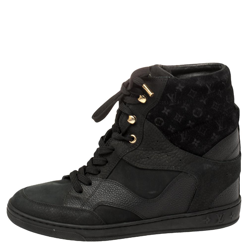 Presenting a sporty design that's blended with the LV touch of luxury. These Millenium wedge sneakers for women are crafted beautifully using quality materials and are set on wedge heels. Lace-up closure and monogram embossing lend the perfect