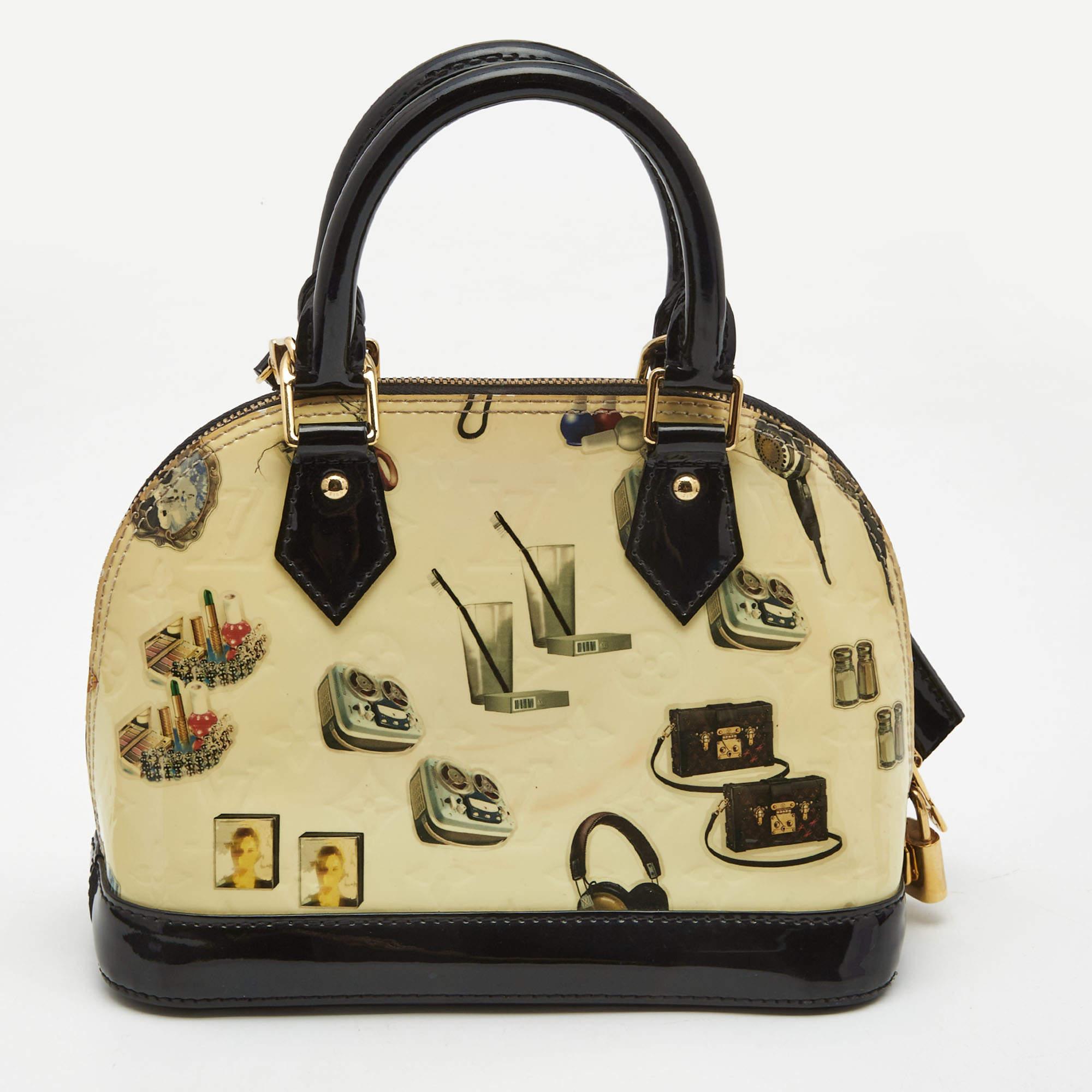 Louis Vuitton's handbags are popular owing to their high style and functionality. This bag, like all their designs, is durable and stylish. Exuding a fine finish, this LV Stickers Alma BB is designed to give a luxurious experience.

Includes: