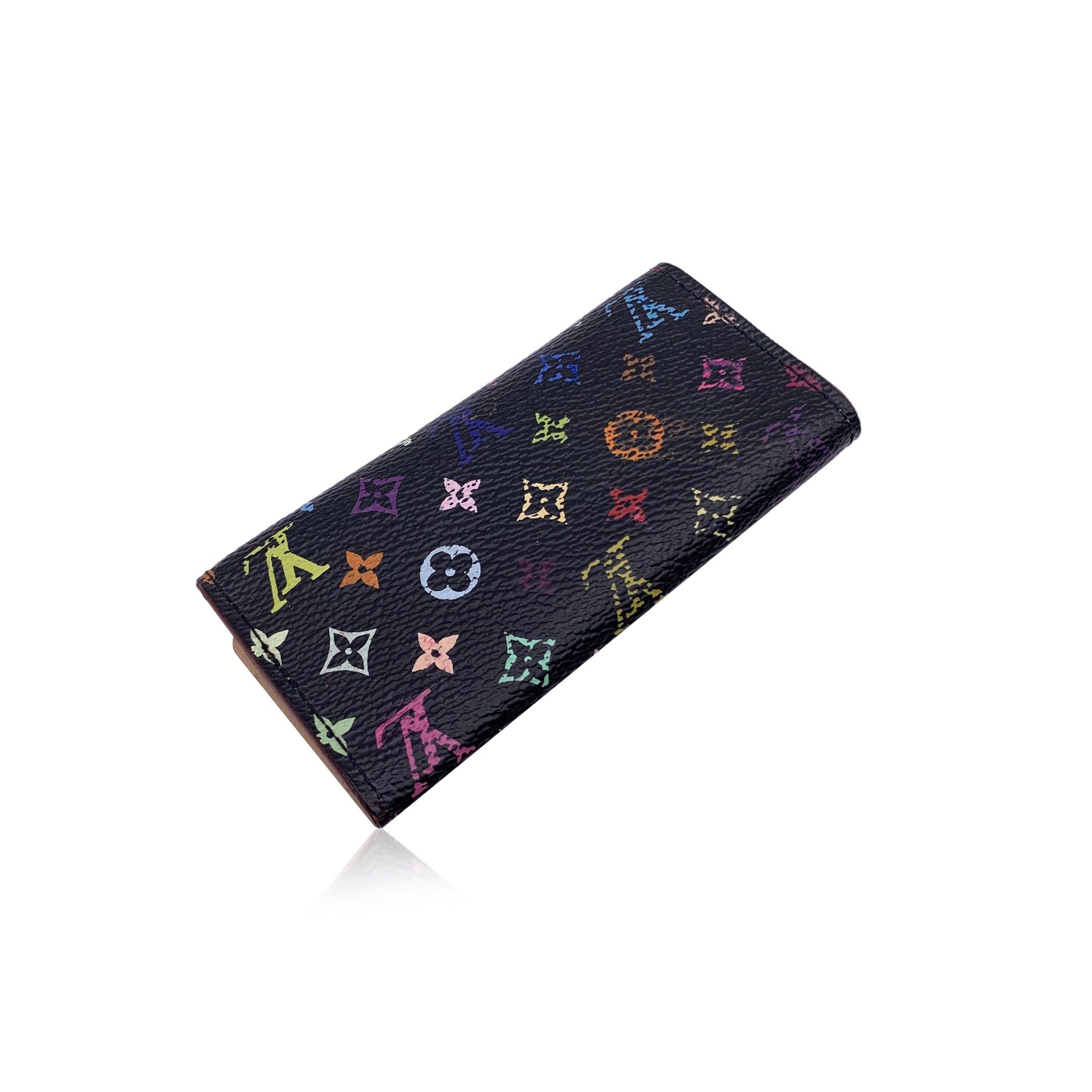Key case 'Multicles' in Murakami Multicolor monogram canvas by Louis Vuitton. Snap closure on the front. Leather lining. Gold metal hardware. 4 key rings inside. 'Louis Vuitton Paris - Made in France' embossed inside. Data code embossed inside