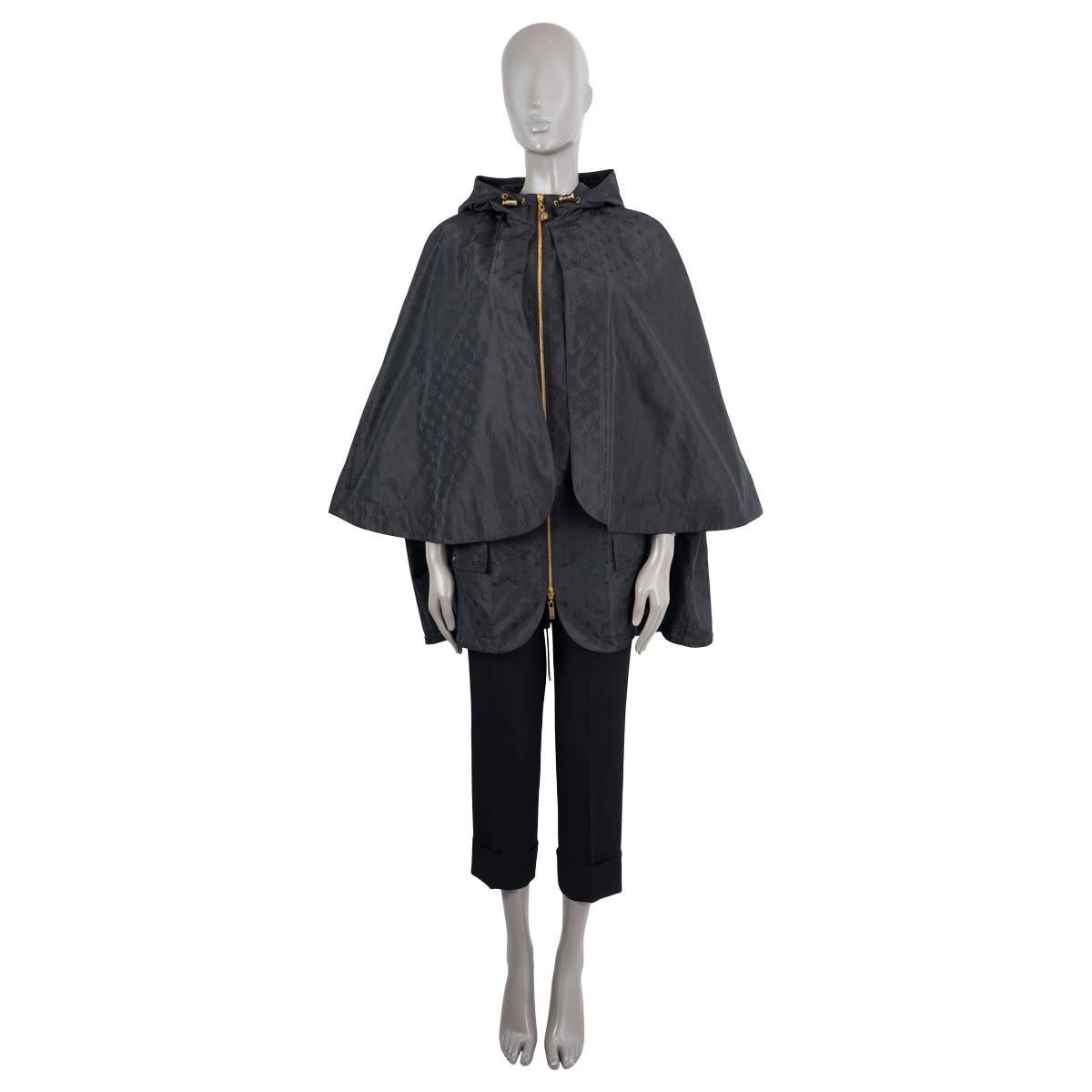 100% authentic Louis Vuitton 2022 sleeveless monogram parka cape in black polyester (53%) and silk (47%). The design features gold-tone hardware, two front flap pockets, double zipper closure and drawstring on hem and hood. Lined in black cotton