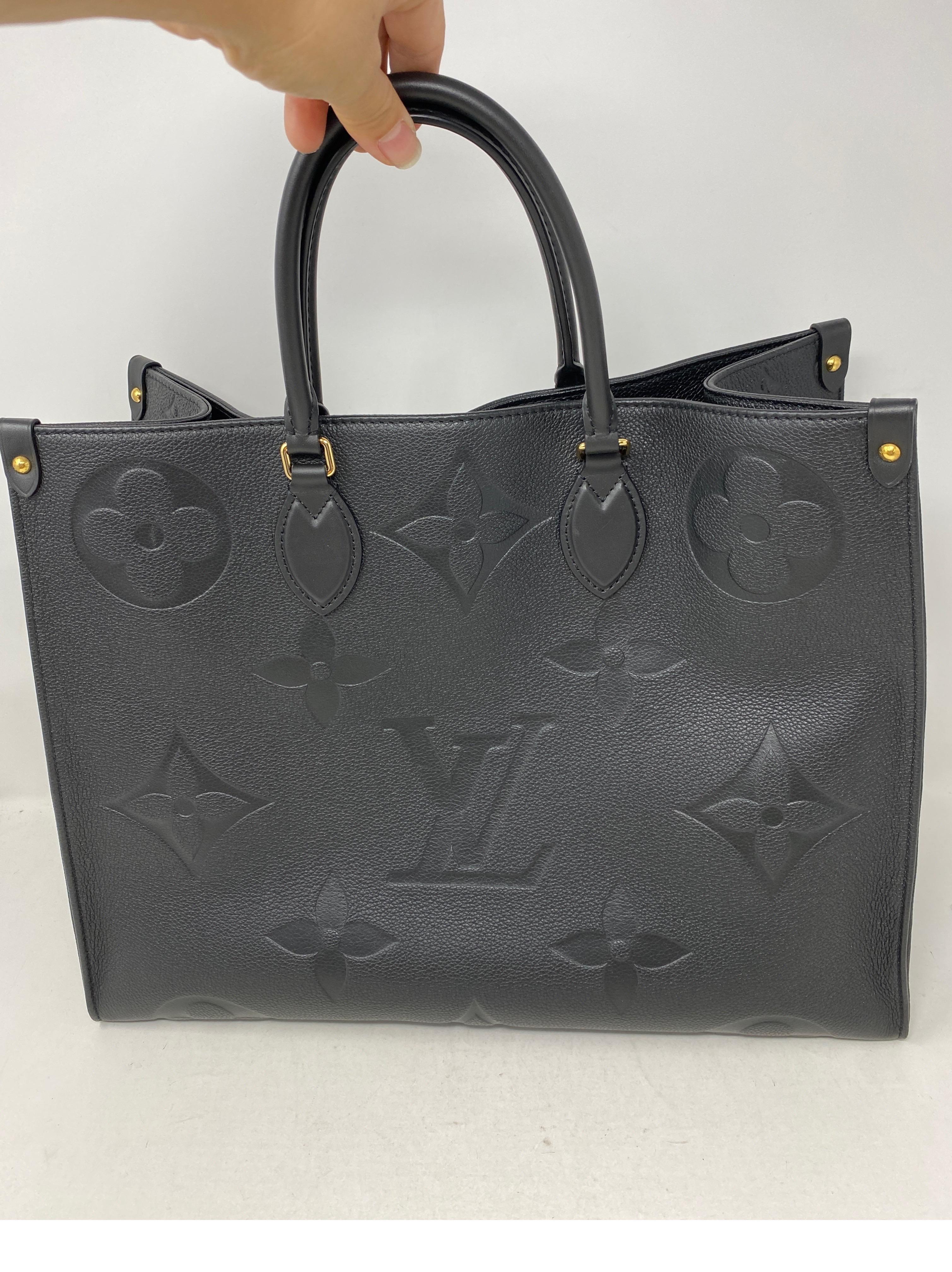 Louis Vuitton Black On The Go Bag. New collection. Hard to find. Excellent condition. Handles can be worn 2 ways. Beautiful bag. Guaranteed authentic.