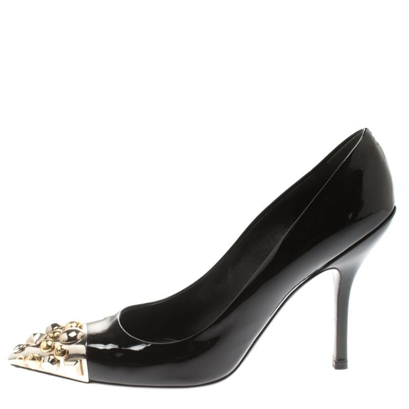 Aren't these Louis Vuitton pumps simply gorgeous! The black pumps have been crafted from patent leather and styled with pointed toes that flaunt stud embellishments. They come equipped with comfortable leather lined insoles and 10.5 cm stiletto