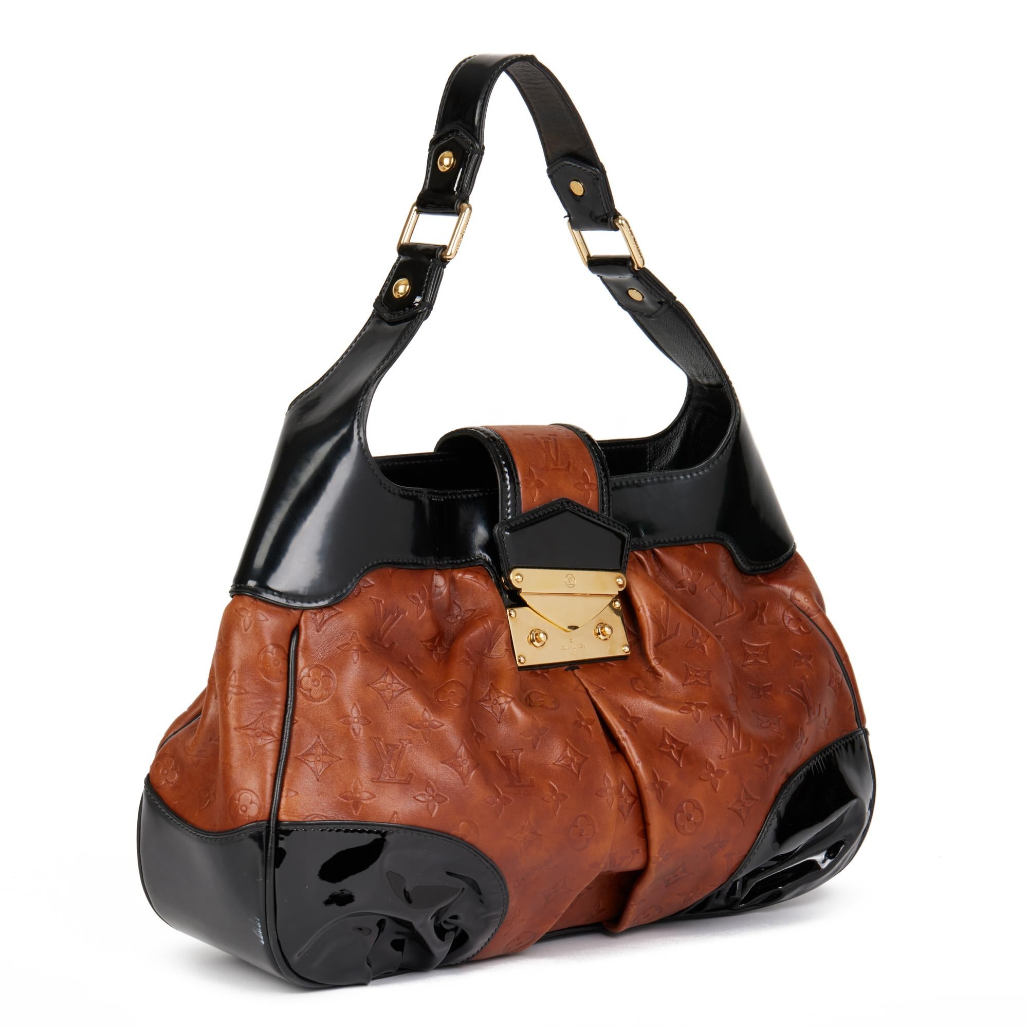 LOUIS VUITTON
Black Patent Leather & Caramel Embossed Calfskin Leather Polly

Serial Number: AR0096
Age (Circa): 2006
Accompanied By: Louis Vuitton Dust Bag
Authenticity Details: Date Stamp (Made in France)
Gender: Ladies
Type: Shoulder,