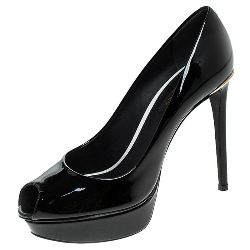 Look smart and stylish in this pair of Eyeline pumps, designed from patent leather. Unleash the smart look with this pair of shoes designed by Louis Vuitton. The pair is styled with platforms, high heels and peep toes. Ideal for formal events, this