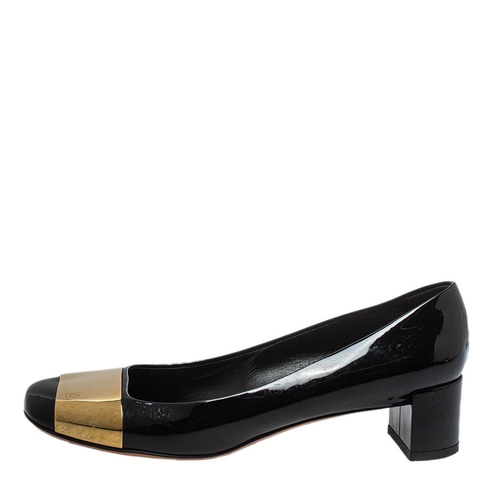 A fine update on the classic black pump, these Louis Vuitton square-toe pumps will instantly be a go-to pair for formals or evening wear. Constructed using black patent leather, the shoes are accented with LV-detailed gold-tone metal on the vamps