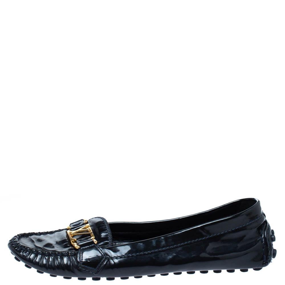 For those special days where you want to put your best foot forward, these shoes from Louis Vuitton are a perfect choice. The black loafers are crafted from patent leather and feature the LV logo in gold-tone on the uppers. Comfortable leather-lined