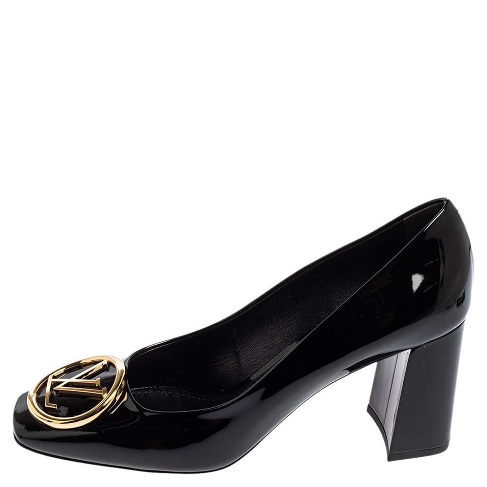 Louis Vuitton's Madeleine pumps exude a refined style and sophisticated vibe with their minimal design. Crafted from black patent leather, they feature the LV logo engraved accents on the front and square toes. These beauties are finished off with