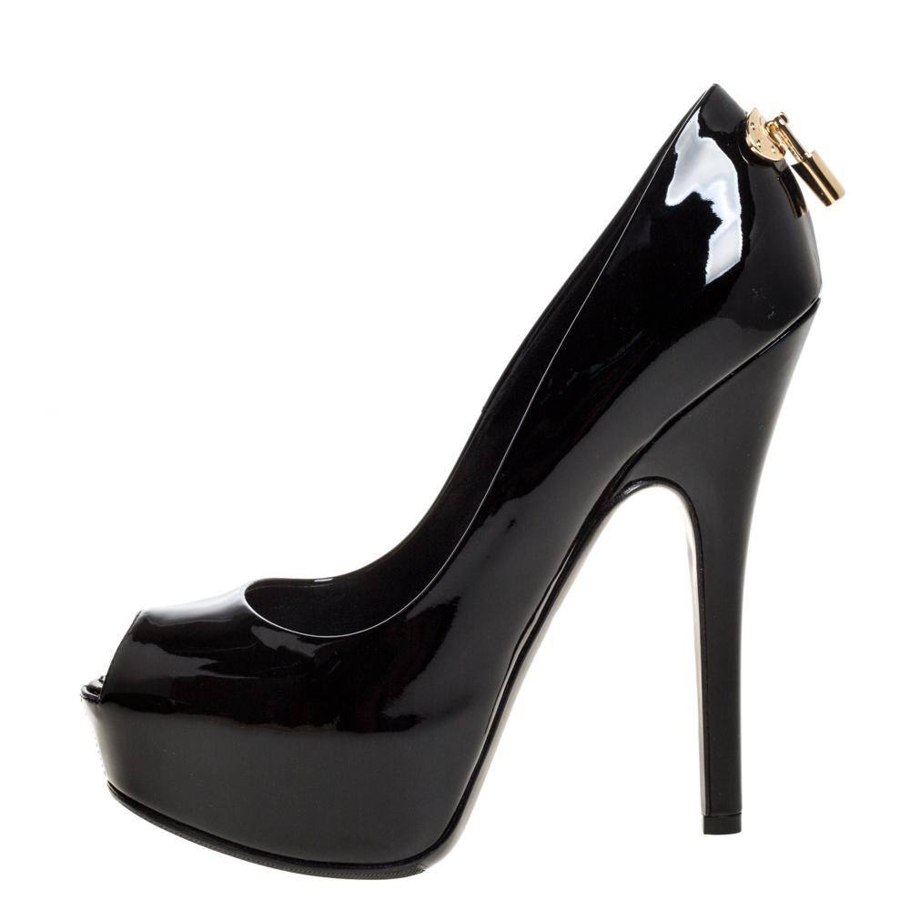How splendid and glorious are these Oh Really! pumps from Louis Vuitton! Sleek in black, they come crafted from patent leather and feature a peep-toe silhouette. They flaunt an artistic gold-tone padlock on the heel counters and are equipped with