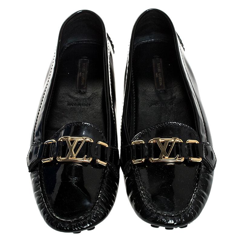 Louis Vuitton's loafers are loved by men and women worldwide as they are perfect for making a fashion statement. These black loafers are crafted from patent leather and feature a chic design. They flaunt round toes, LV motifs on the vamps,