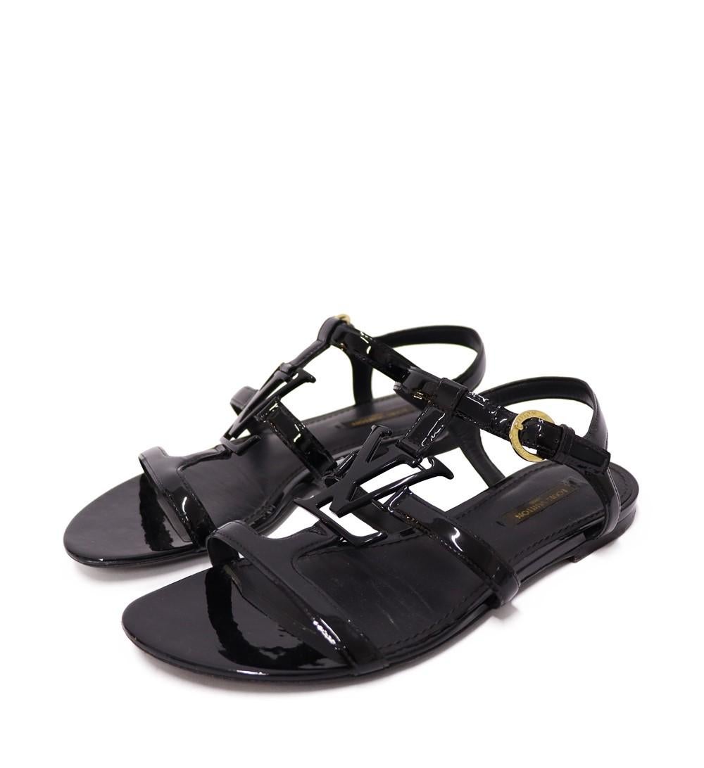 Louis Vuitton Black Patent Leather Paradiso Flat Gladiator Sandals, Features a cage-like LV logo straps, open toes and buckled closures

Material: Leather
Size: EU 37
Overall Condition: Very good
Interior Condition: Some dirt and scratches
Exterior