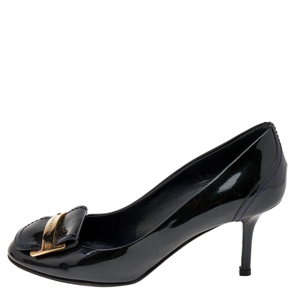 Outline a sophisticated look in these chic pumps from Louis Vuitton. The black pumps have been crafted from patent leather and styled with square toes and gold-tone logo accents on the uppers. They are endowed with comfortable insoles and elevated