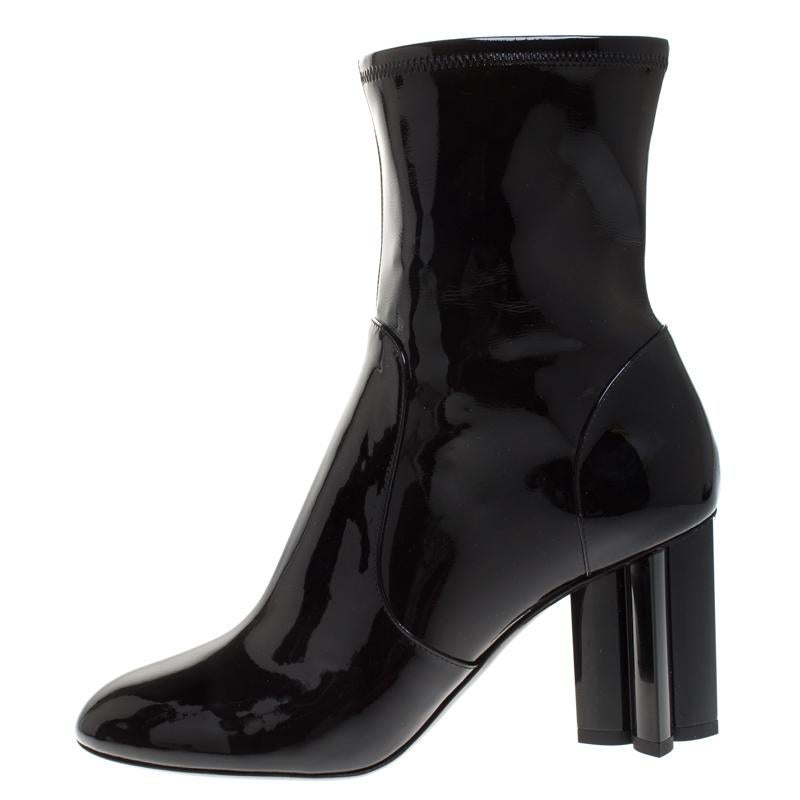 Created by Louis Vuitton, this luxury pair has a statement of its own. These ankle boots are crafted from black patent leather and feature side zippers and round toes. They are set on block heels carved as the brand's monogram flower.

