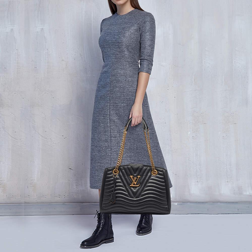 Thoughtful details  high quality  and everyday convenience mark this Louis Vuitton New Wave bag for women. The bag is sewn with skill to deliver a refined look and an impeccable finish.