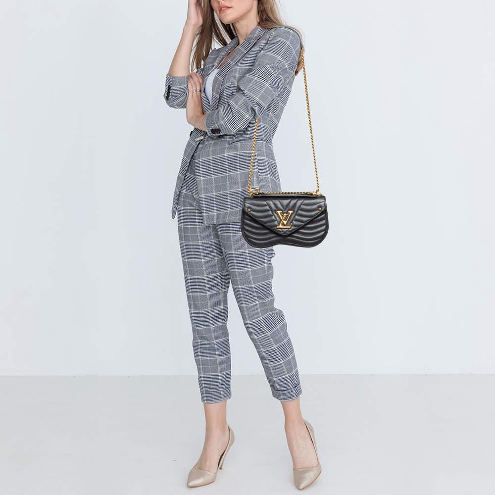 A classic handbag comes with the promise of enduring appeal boosting your style time and again. This Louis Vuitton New Wave Chain MM bag is one such creation. It's a fine purchase.