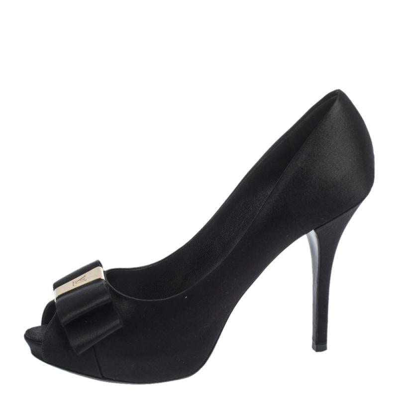 Stylish, sophisticated and glamorous, these pumps by Louis Vuitton will make sure your formal ensembles are elevated instantly. Crafted from quality satin, they come in a classic shade of black. They are styled with peep toes, bow detailing with