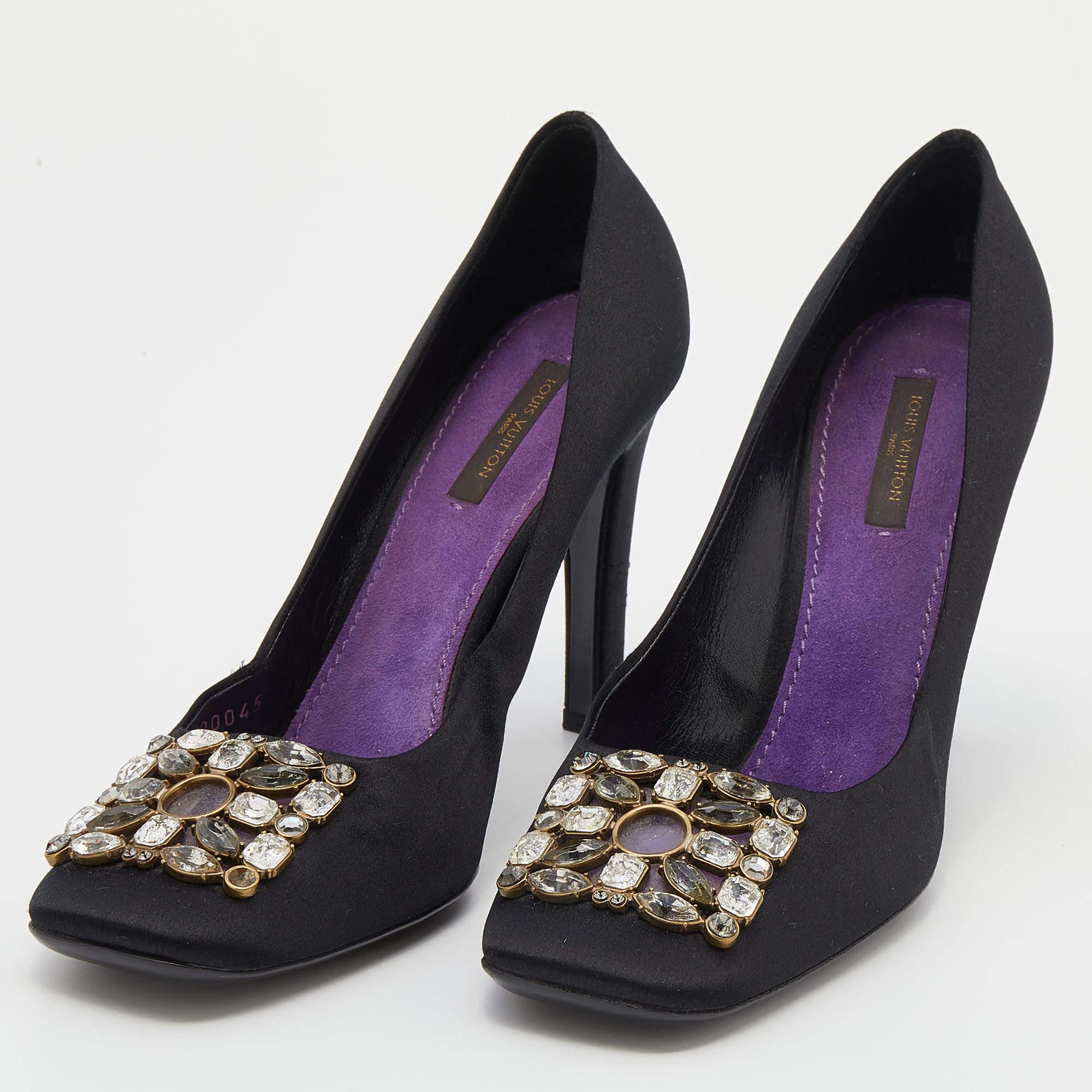 These Louis Vuitton pumps are perfect for special occasions. Crafted from black satin they are equipped with square toes that are further enhanced by crystal embellishments. They come with 10.5 cm heels suede insoles and leather soles. Subtle and