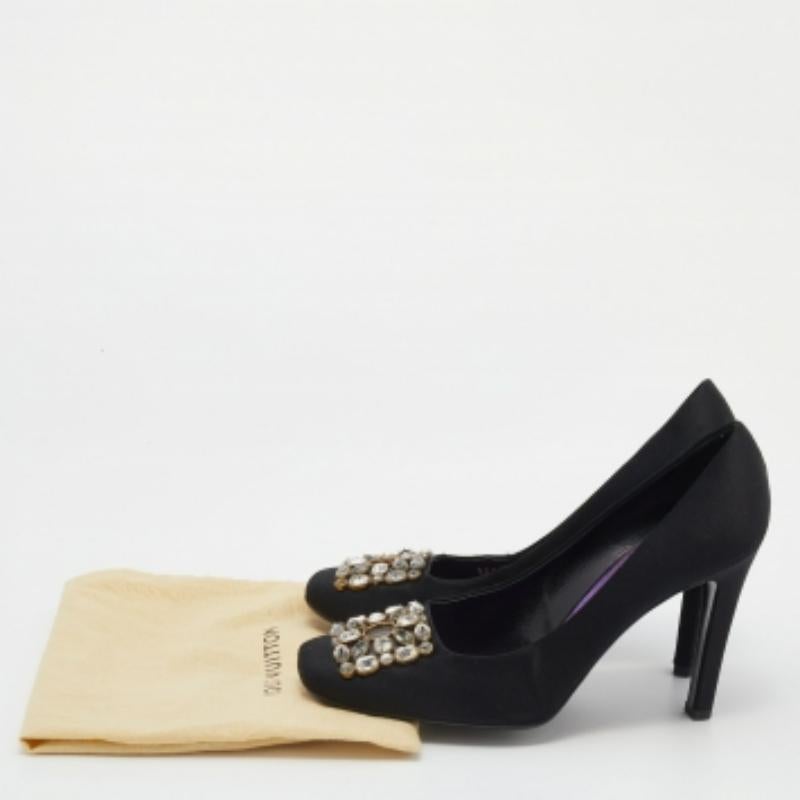 These Louis Vuitton pumps are perfect for special occasions. Crafted from black satin, they are equipped with square toes that are further enhanced by crystal embellishments. They come with 10.5 cm heels, suede insoles, and leather soles. Subtle and