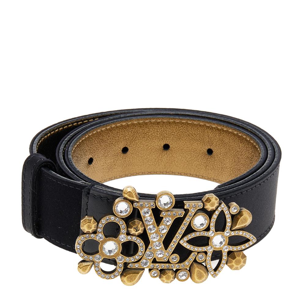 This gorgeous Runway belt from Louis Vuitton will lend an extra character to your chic, statement dresses. This belt, crafted from satin and leather, features a beautiful rhinestone-encrusted LV buckle. The buckle is surrounded by an arrangement of