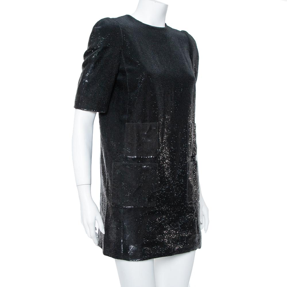 Look glamourous in this breathtaking dress from the house of Louis Vuitton. Made from a blend of fabrics and covered in black sequin, this dazzling dress has short sleeves and a rear zip closure. Style it with matching accessories and heels for your