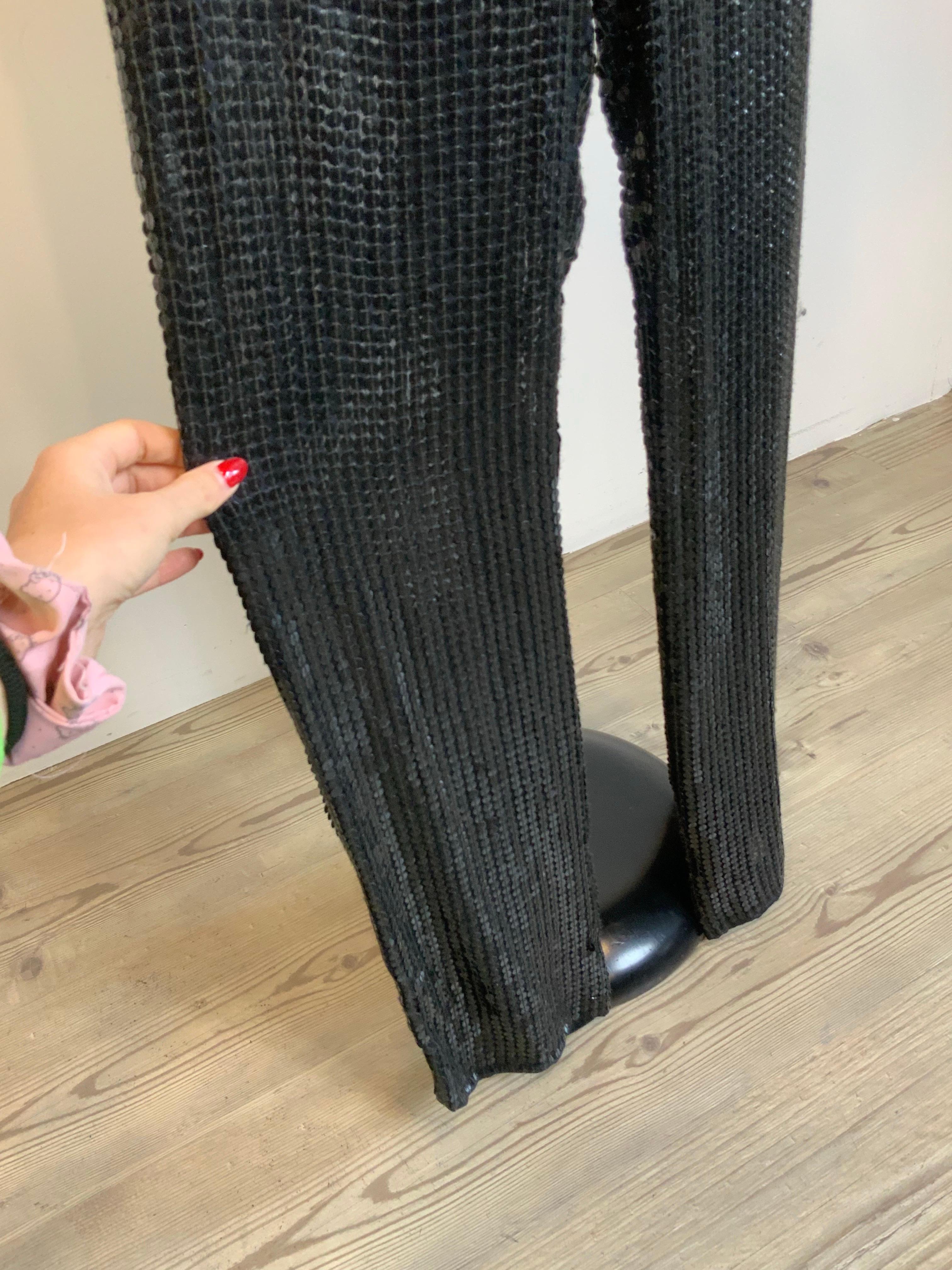 Louis Vuitton black trousers with sequins. 
The trousers have no composition label and no label indicating the size. We think it's silk, a slightly transparent material.
Fits an international S.
Length 107 cm
Waist 35 cm
Hips 44 cm
Excellent general