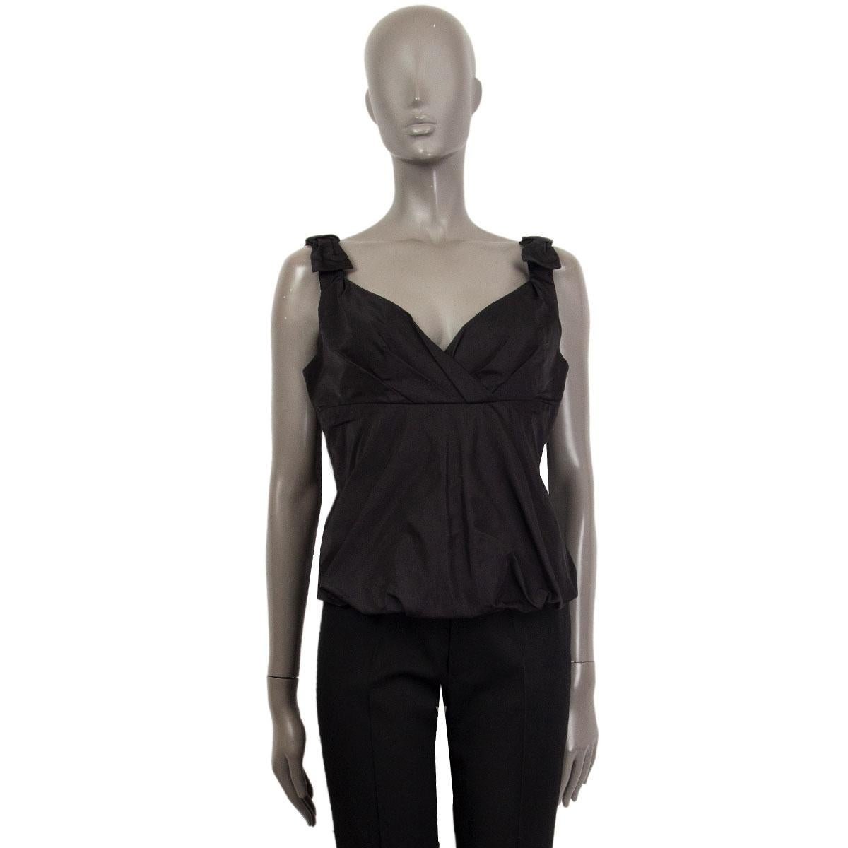 100% authentic Louis Vuitton sleeveless bustier-style top in black silk (100%) embellished with bow detail on shoulders. Opens with a zipper on the back. Has been worn and is in excellent condition. 

Measurements
Tag Size	40
Size	M
Bust To	84cm