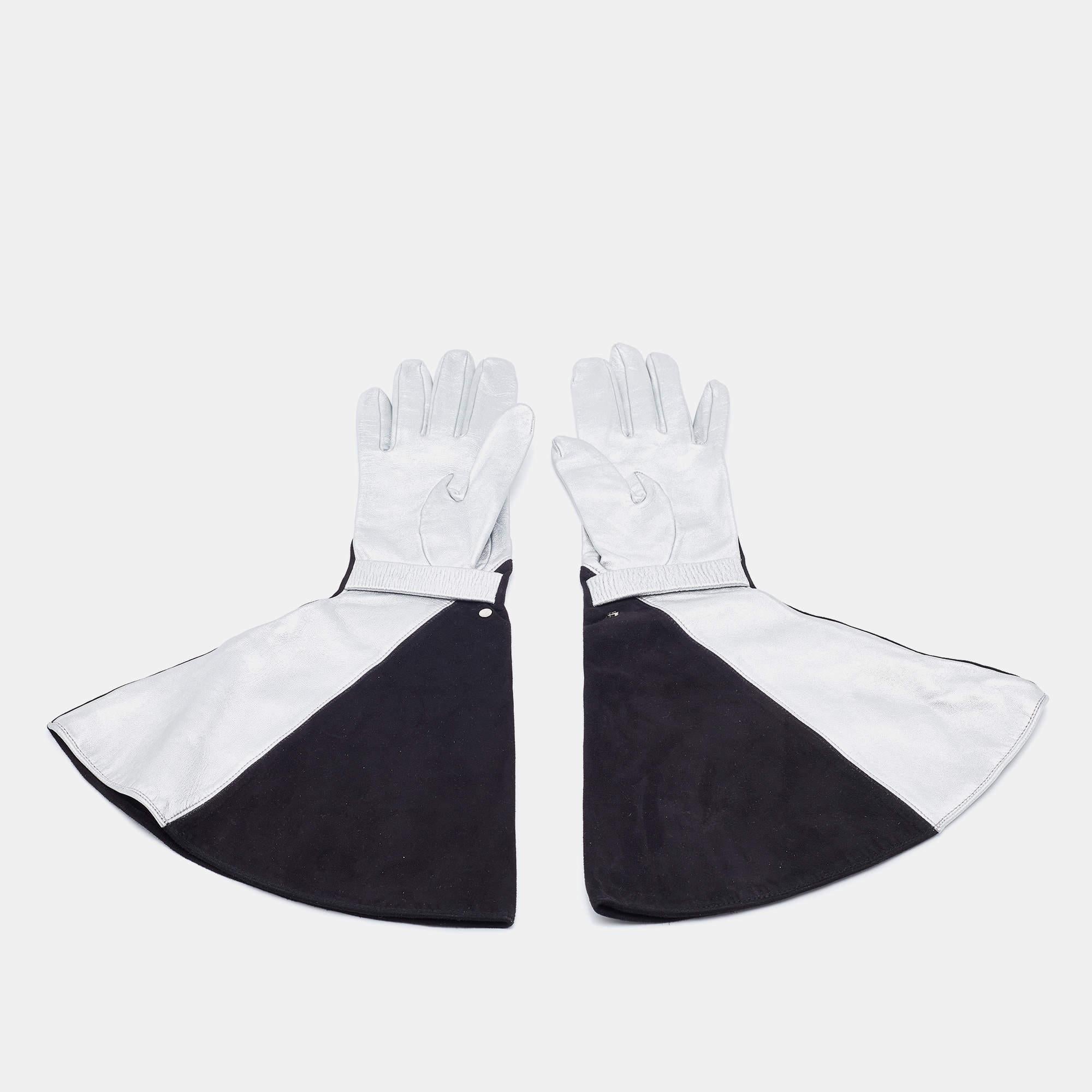 When a pair of gloves can carry such high style! This pair by Louis Vuitton is made of black suede and silver leather, and the design is quite statement-making. 