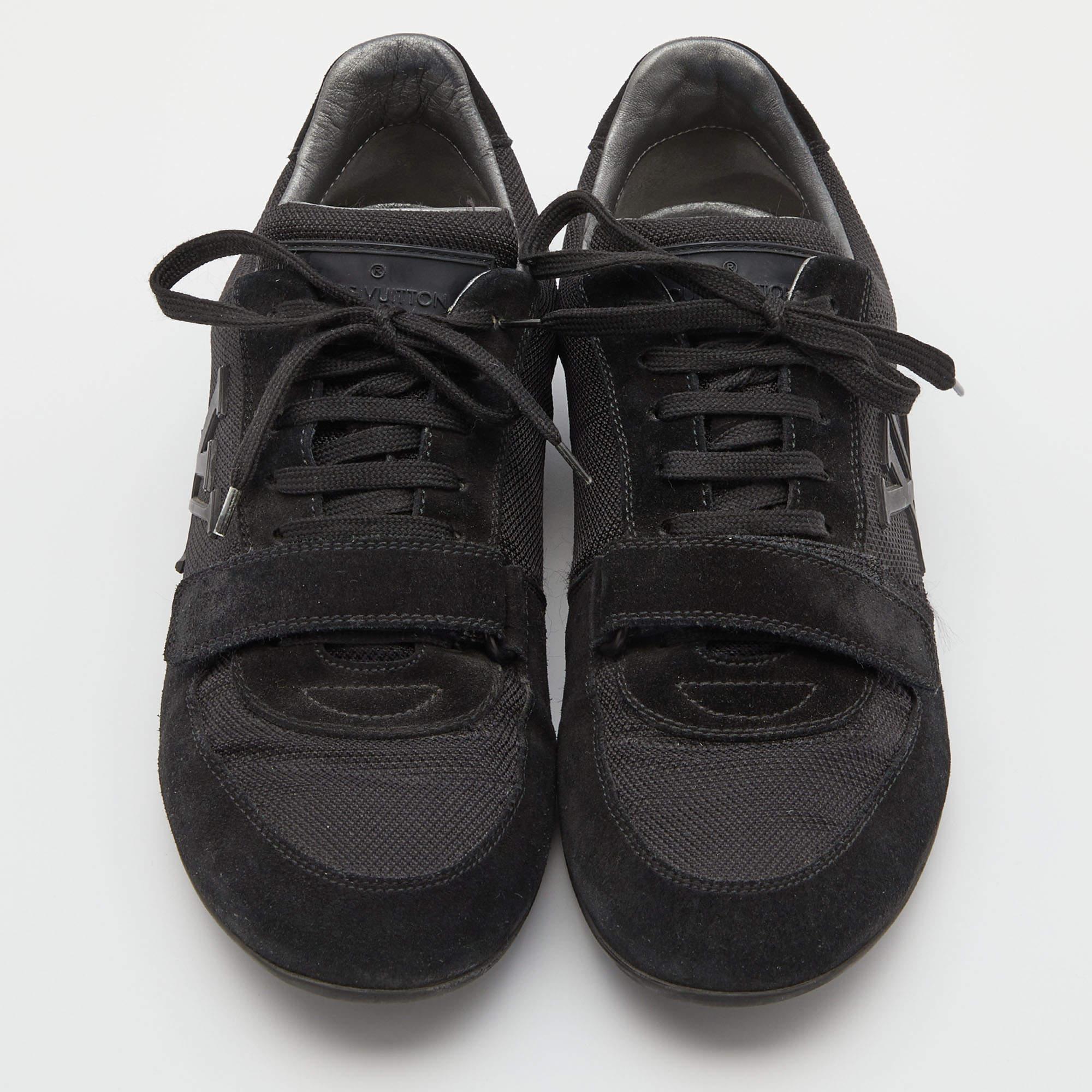 This classy and casual pair of low-top sneakers from Louis Vuitton is a must-have! They are made from suede & mesh and come in a versatile shade of black. It flaunts the logo on the sides, lace-ups on the vamps, and is complete with rubber soles.

