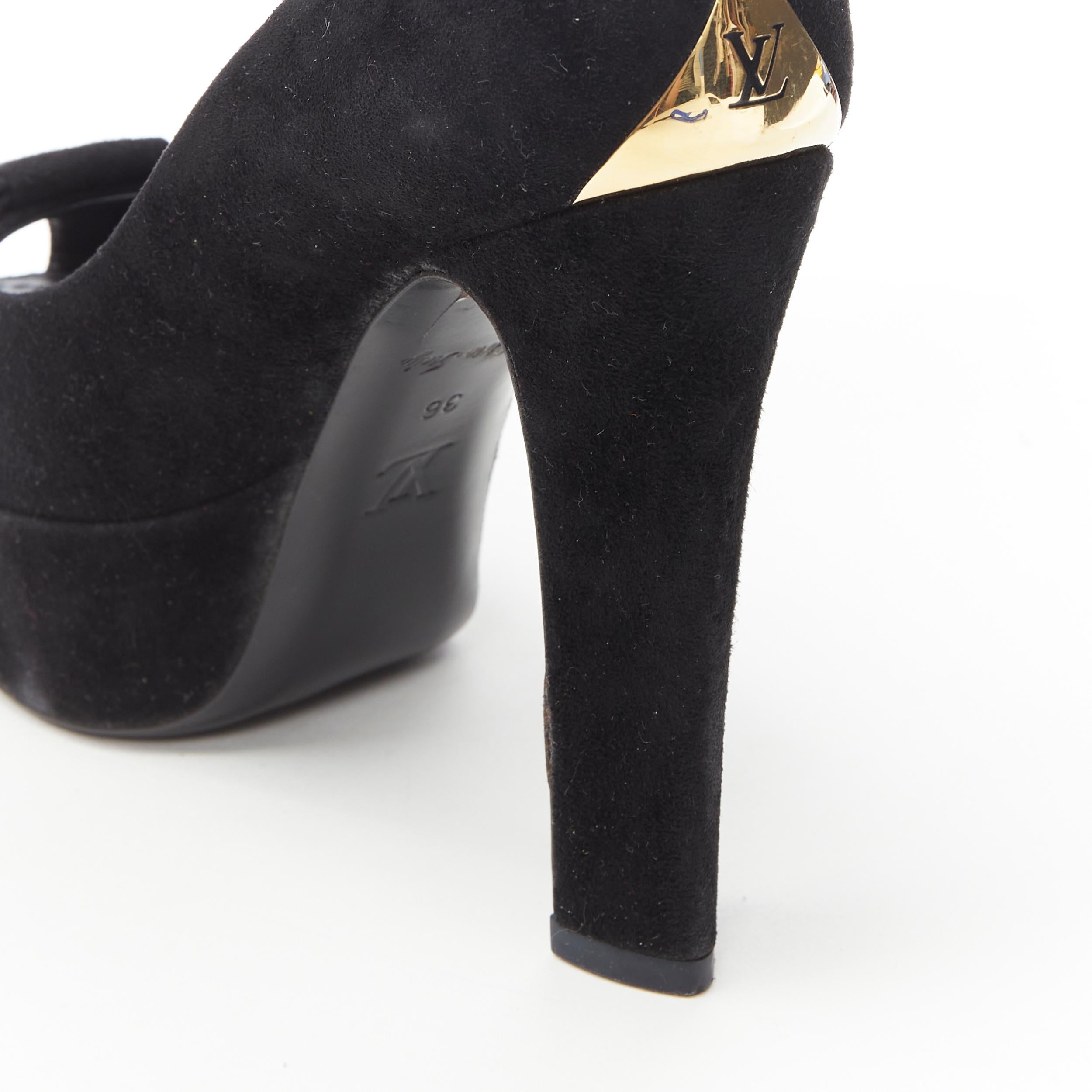 LOUIS VUITTON black suede bow peep toe platform gold LV metal plate pump EU36 
Reference: TGAS/B00223 
Brand: Louis Vuitton 
Material: Suede 
Color: Black 
Pattern: Solid 
Extra Detail: Suede upper. Large bow. Peep toe. Platform sole. Gold tone