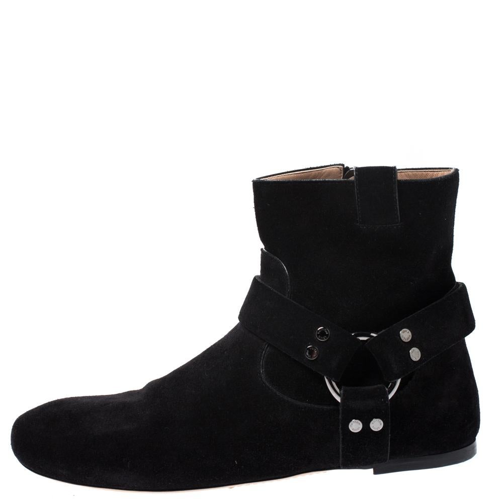 It's suede fever this season! For the urbane fashion diva in you, this black pair from Louis Vuitton is the classical pick. These exquisitely designed ankle boots are crafted from suede, styled with round toes and studded strap around ankles. They