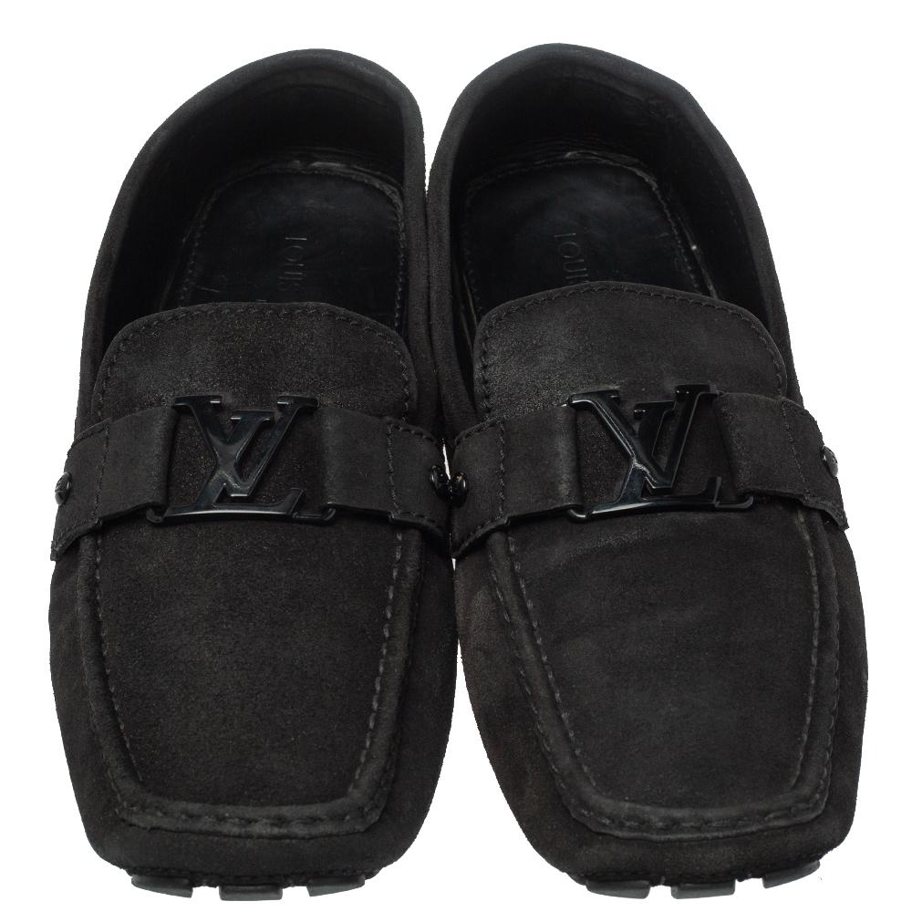 Look sharp with this pair of Monte Carlo loafers from Louis Vuitton. They have been crafted from black suede and designed with the art of fine stitching and the signature LV on the uppers. The pair is complete with comfortable insoles and durable
