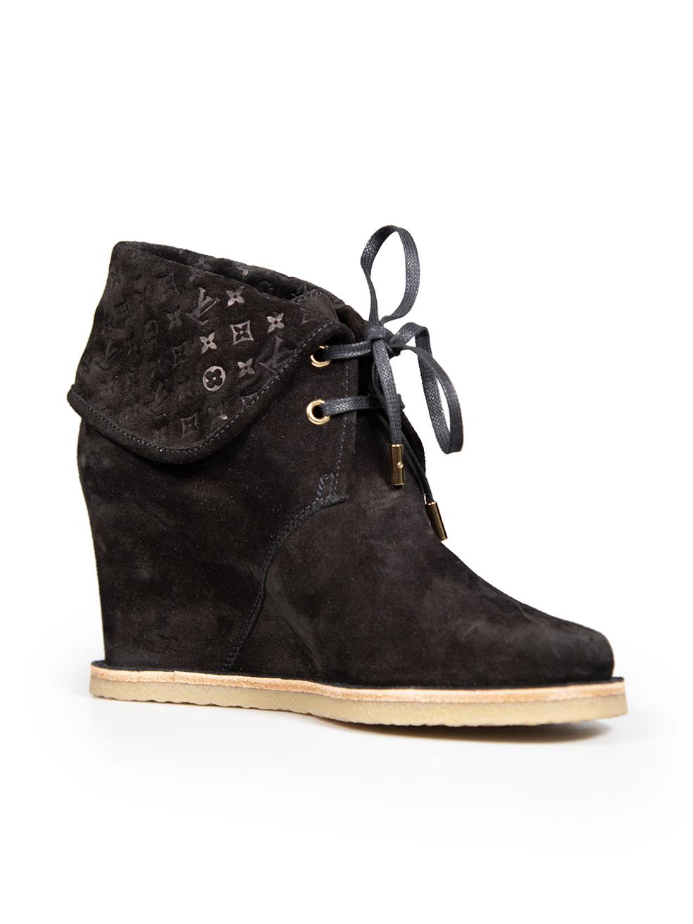 CONDITION is Very good. Minimal wear to boots is evident. Minimal scratches to the suede exterior at the back counter of both shoes on this used Louis Vuitton designer resale item. The item comes with dust bag and box.
 
 Details
 Black
 Suede
