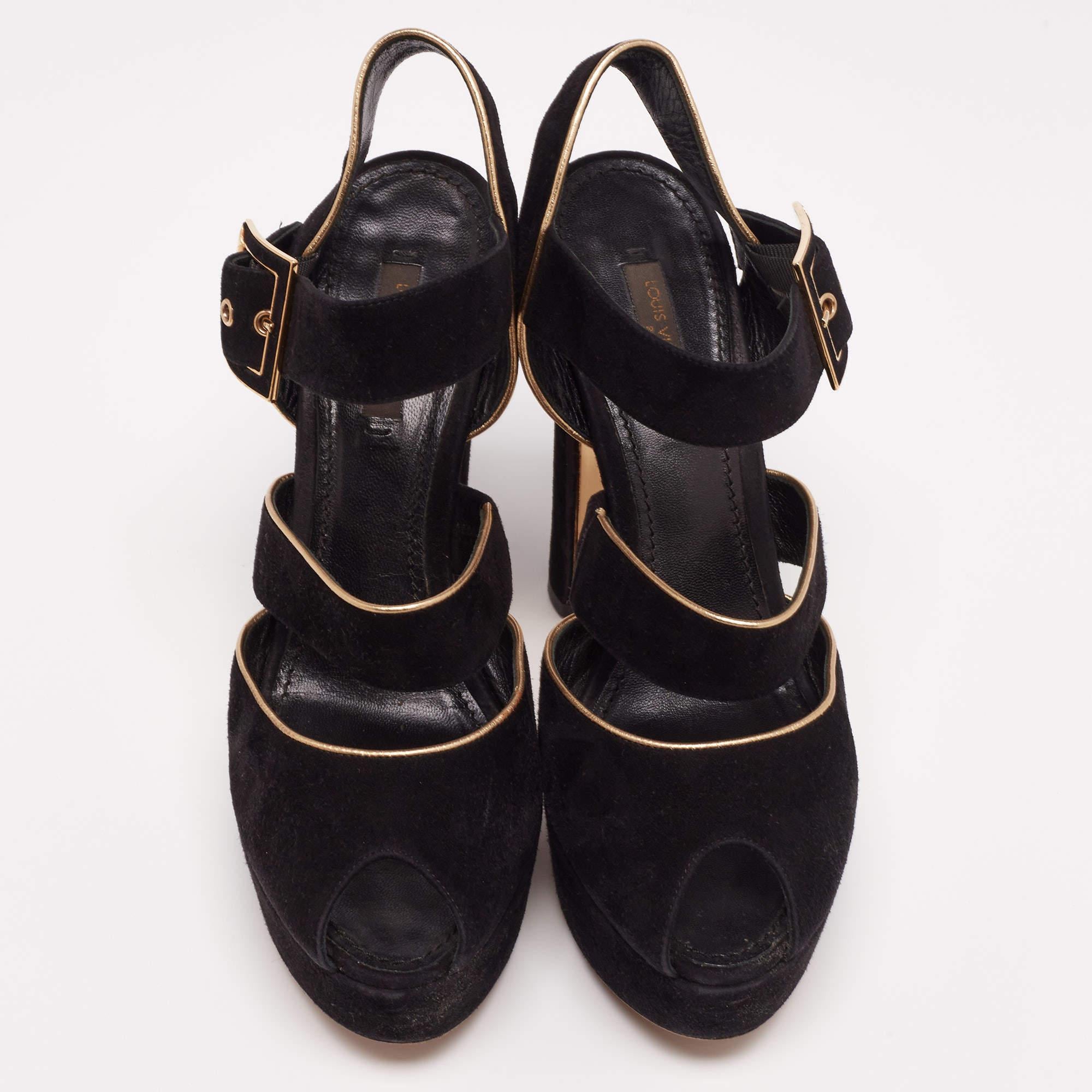 This classy pair of sandals from Louis Vuitton looks even better on the feet. The shoes have a suede exterior added with metallic trims, simple buckle closure, and open toes. They are lifted on platforms and 12.5 cm heels.

Includes: Original