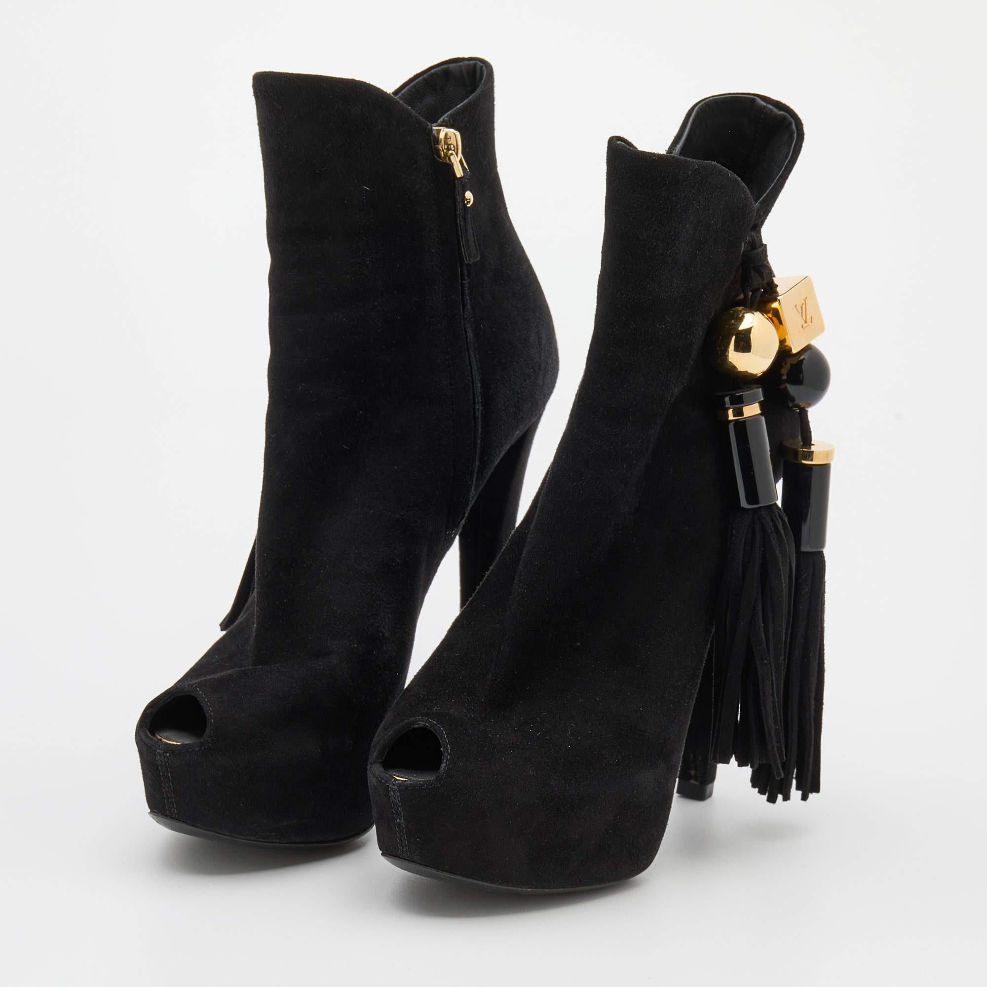 Louis Vuitton is all set to impress you with this stunning pair of booties. Crafted from suede, they feature peep toes. This pair of booties will raise your style factor.

