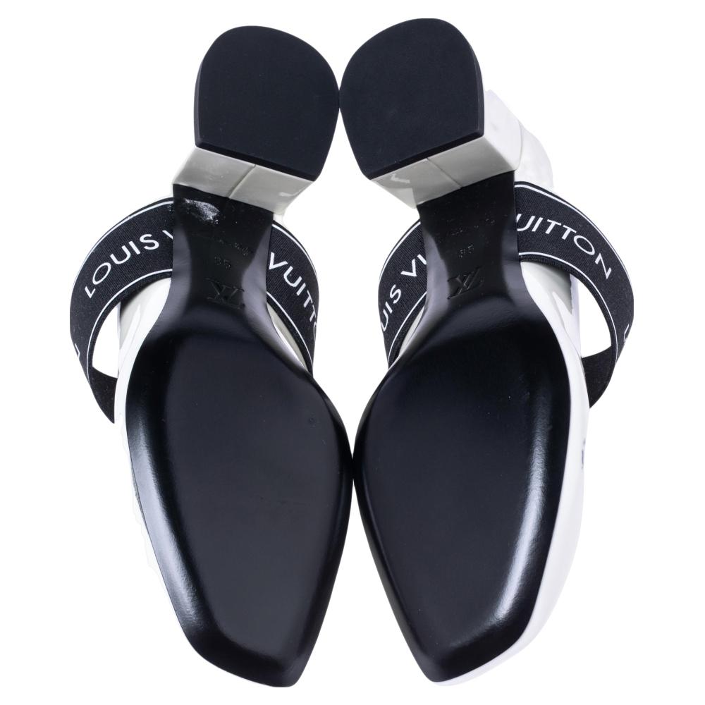 A feminine flair, sleek cuts, and a sophisticated appeal characterize these chic Louis Vuitton sandals. Crafted from suede in a black shade, they are designed with broad straps accentuated with the signature Essential V motif. These sandals are