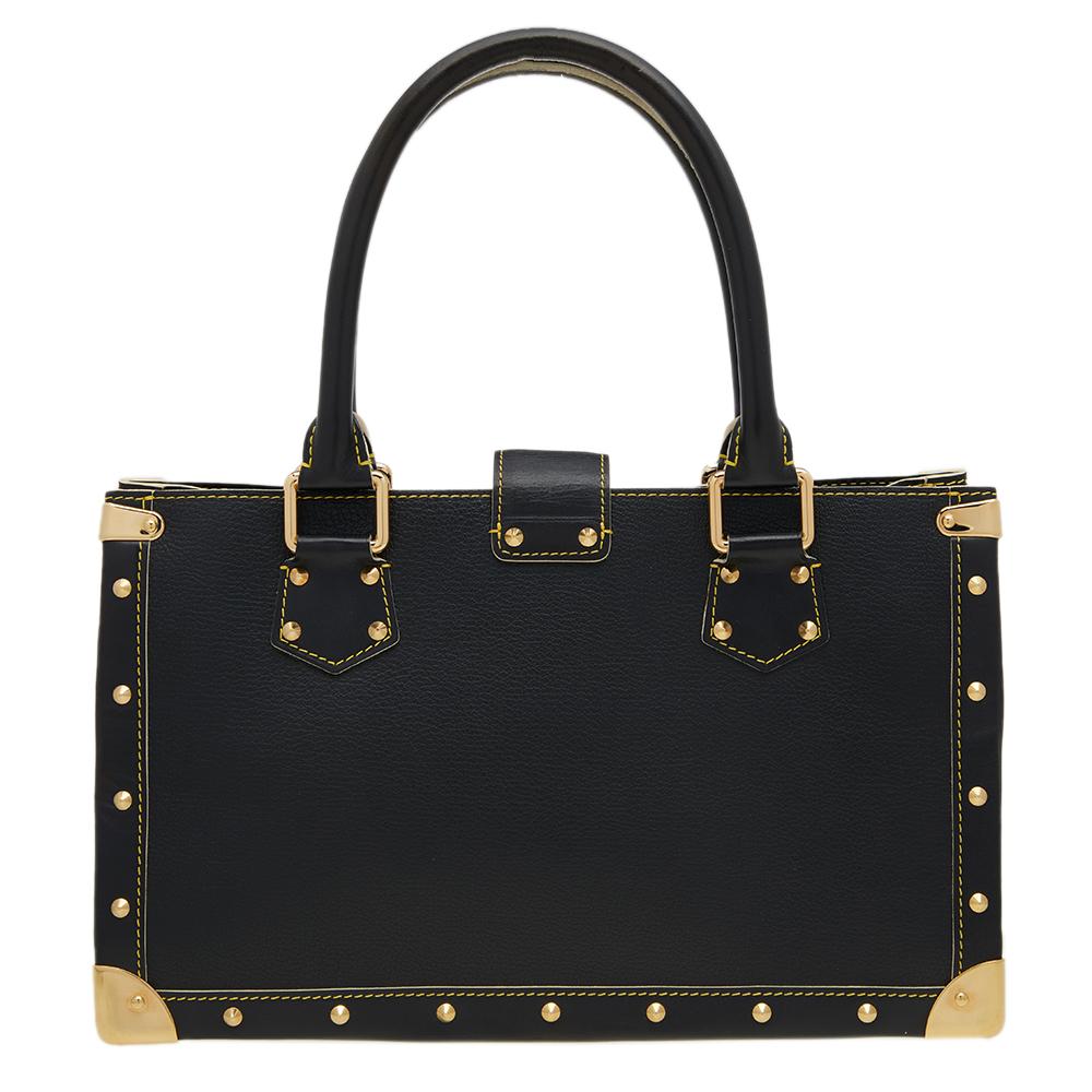 Louis Vuitton's Le Fabuleux bag has a trunk-inspired look, a blissful reminder of the brand's heritage! Rectangular in shape, the bag is crafted from black Suhali leather and has gold-tone metal fittings. It features dual top handles, a front zip