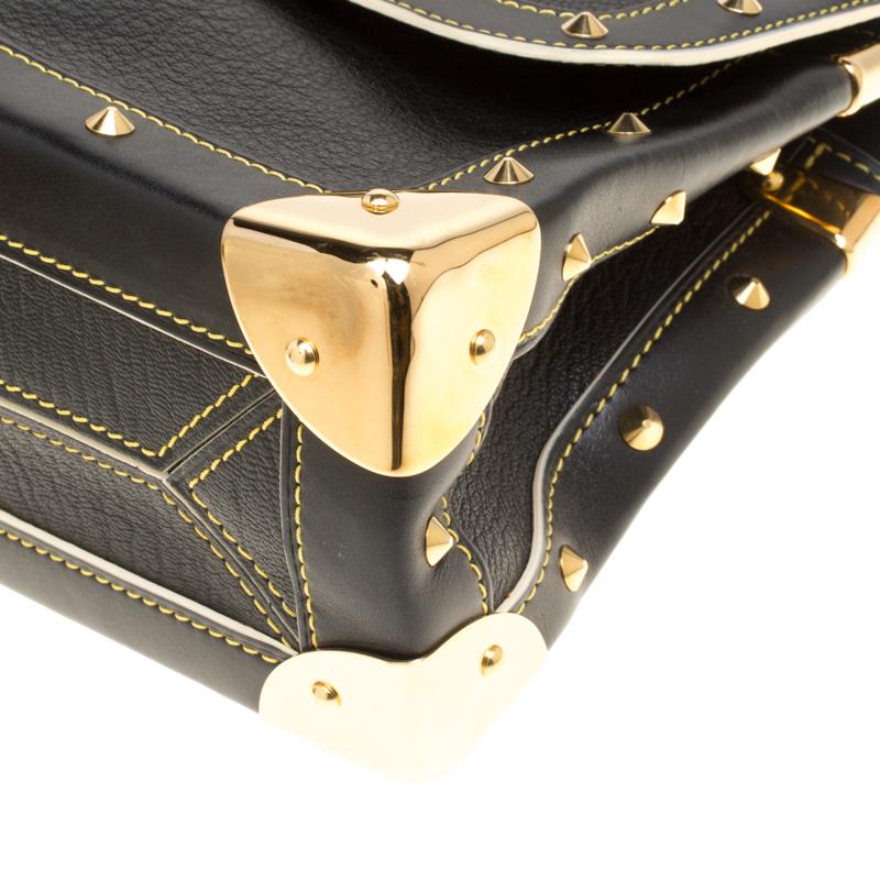This Suhali Le Talentueux bag from Louis Vuitton is gorgeous. The black beauty is crafted from leather and flaunts a unique and distinctive style. It features beautiful gold-tone pyramid studs, a push lock closure, rings and metal reinforced edges,
