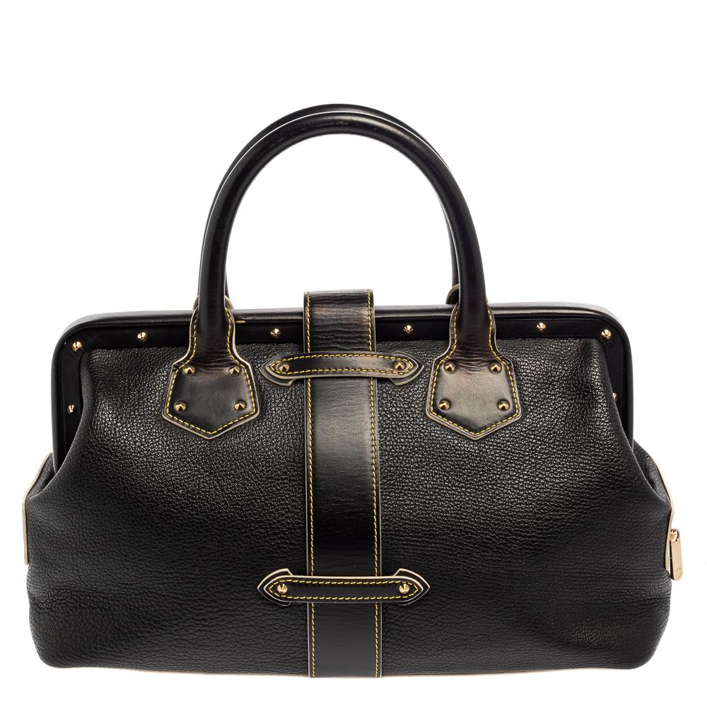 This Louis Vuitton Lingenieux PM bag is crafted to perfection. This black Suhali leather tote is adorned with gold-tone studs, a signature lock with the Louis Vuitton insignia, and side zip pockets. The interior is lined with fabric. The rolled