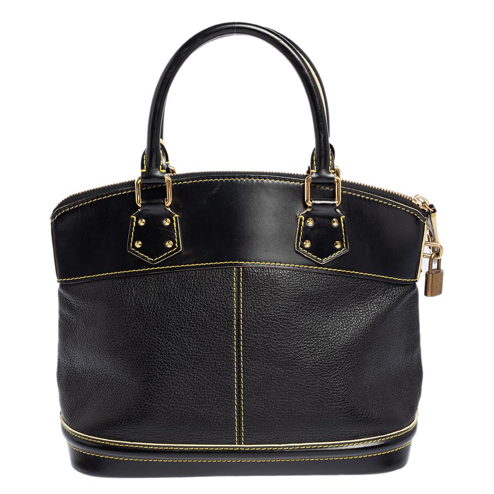 Constructed in the iconic shape, this Louis Vuitton Lockit bag strikes the right balance between style and functionality. It is made from black Suhali leather with contrast stitch details, dual rolled top handles, gold-tone accents, a padlock, and a